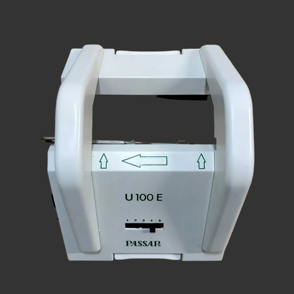 Passap U100E Electronic Knitting Machine pattern lock, predominantly white in color with some black detailing, displayed on a wooden surface.