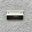 A cleaning brush with a white plastic base and black bristles, designed for a Silver Reed SK 890 Chunky Electronic Knitting Machine.