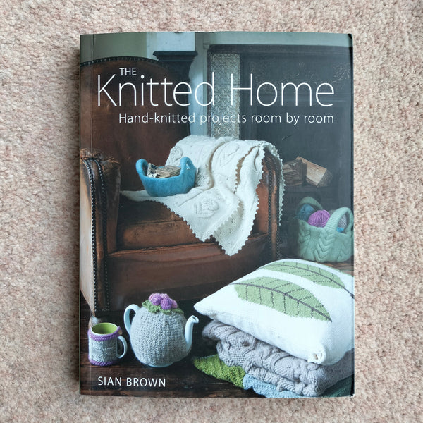 A hand knitting book called The Knitted Home: Hand-knitted projects room by room book by Sian Brown