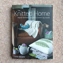 A hand knitting book called The Knitted Home: Hand-knitted projects room by room book by Sian Brown