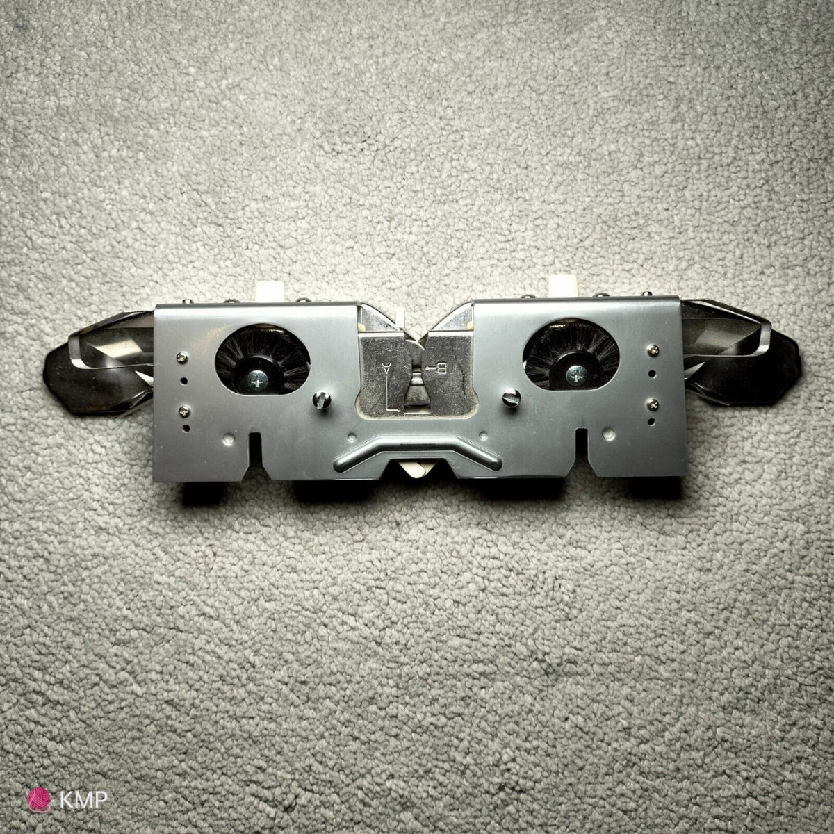 Brother KH-900 Electroknit Knitting Machine Main Carriage, showing signs of rust, placed on a flat surface. Main image