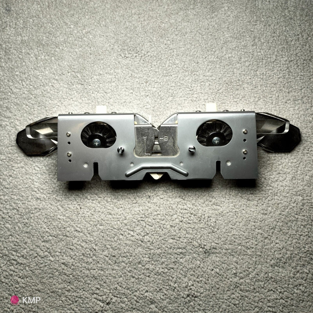 Brother KH-900 Electroknit Knitting Machine Main Carriage, showing signs of rust, placed on a flat surface.