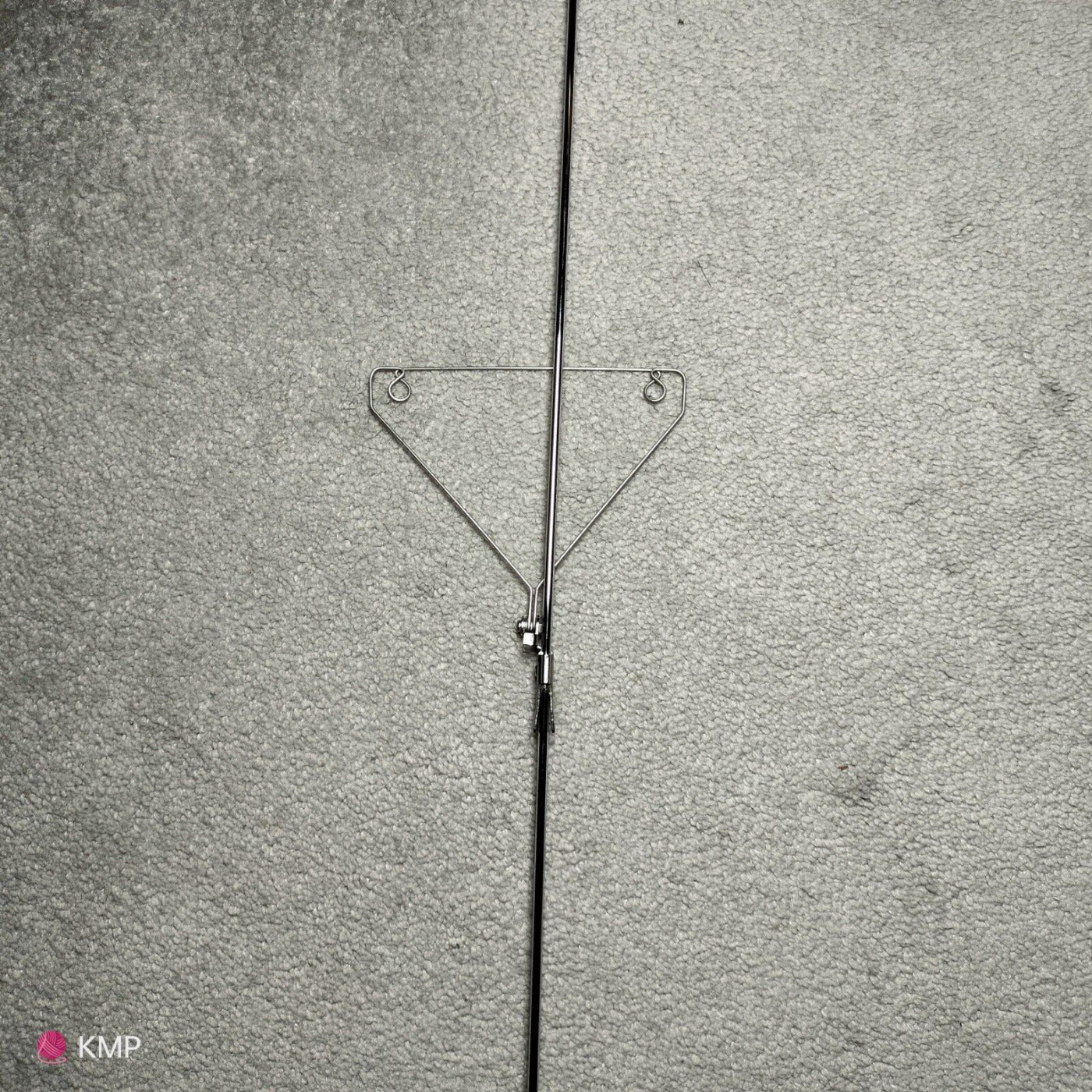 Brother KH-900 Electronic Knitting Machine Yarn Tension Unit ROD, showing a metal rod with a triangular support structure, against a grey background. Main image