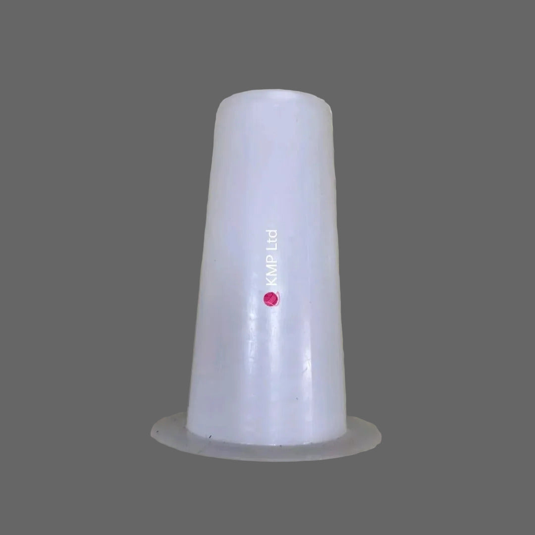 A white plastic cone-shaped wool winder hat displayed on a wooden surface.