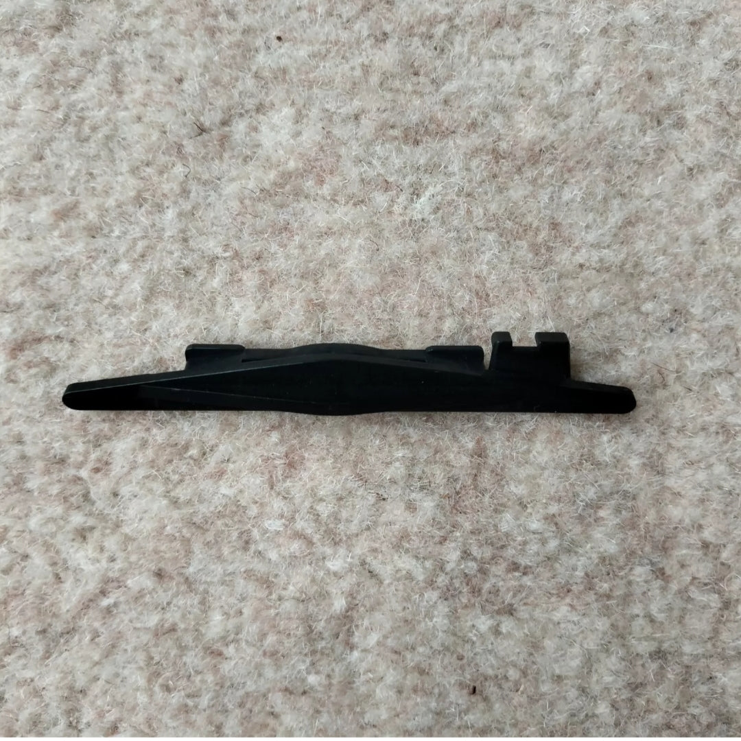 A black plastic row counter trip cam for a Passap Duomatic 80 knitting machine, placed on a beige carpet background. Main image