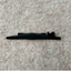 A black plastic row counter trip cam for a Passap Duomatic 80 knitting machine, placed on a beige carpet background.