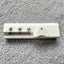 Silver Reed SK 890 Chunky Electronic Knitting Machine ROW COUNTER on a grey background, showing a white plastic body with three control buttons and a digital display.