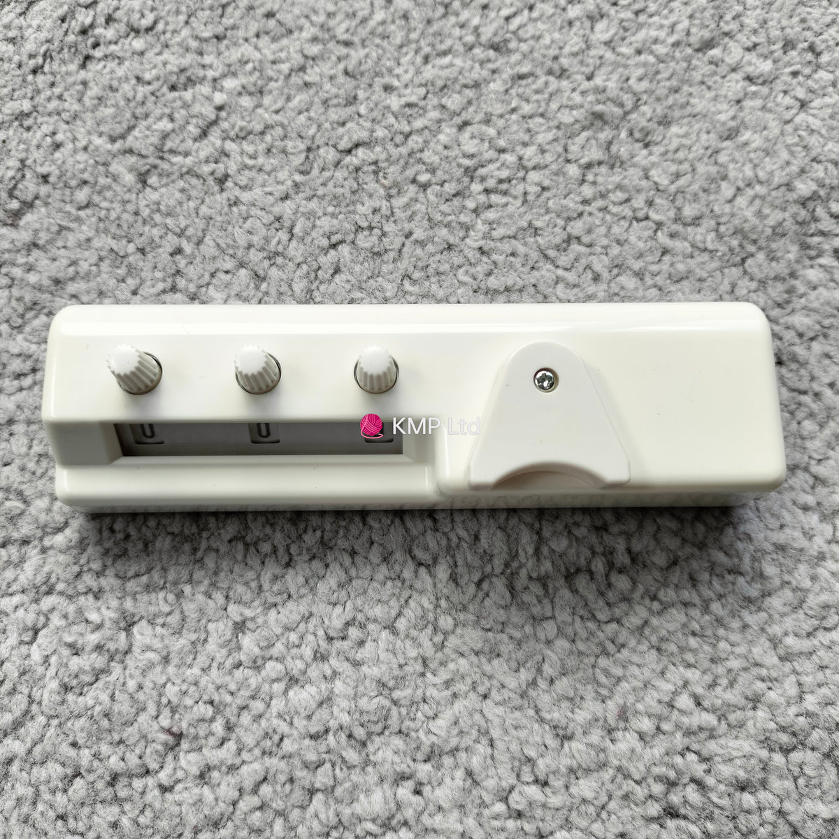 Silver Reed SK 890 Chunky Electronic Knitting Machine ROW COUNTER on a grey background, showing a white plastic body with three control buttons and a digital display.