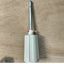 A used Toyota KR 506 Ribber Knitting Machine RACKING HANDLE with a metallic shaft and a white, rubber-coated grip, placed on a wooden surface.