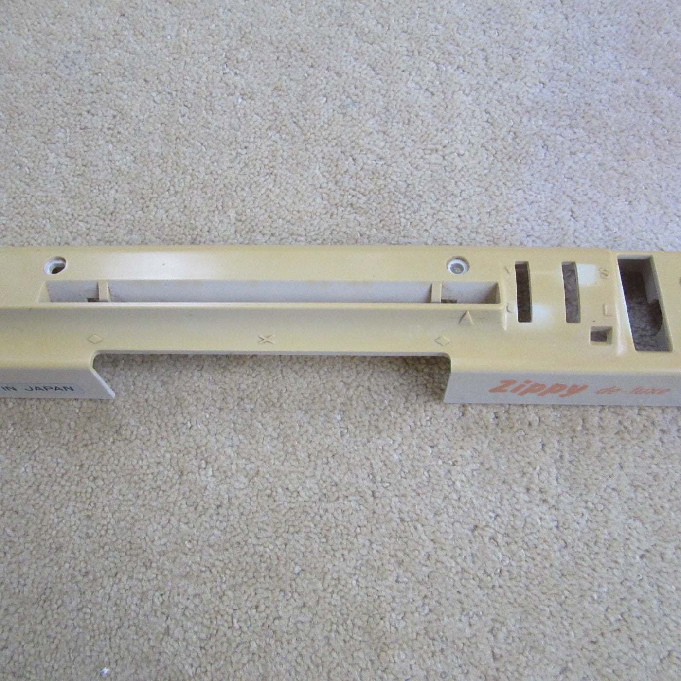 Punchcard pattern system unit cover for a Knitmaster ZIPPY DE-LUXE knitting machine, showing signs of wear.
