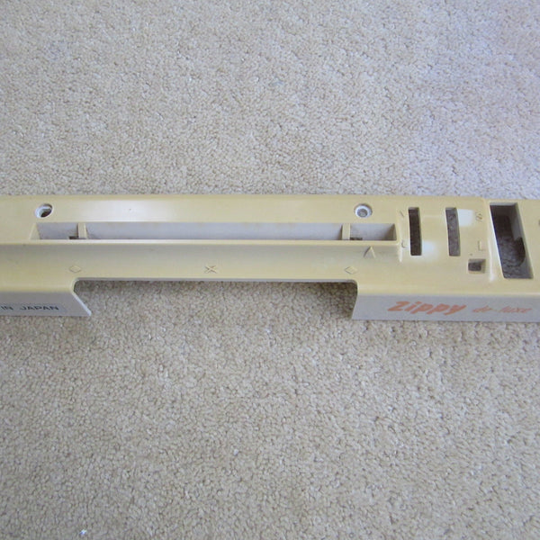 Punchcard pattern system unit cover for a Knitmaster ZIPPY DE-LUXE knitting machine, showing signs of wear.